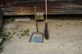 Vintage broom and scoop in the village on a sunny cleaning day