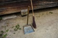 Vintage broom and scoop in the village on a sunny cleaning day