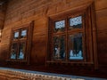 Vintage brown country wooden window. Antique traditional building exterior detail. Travel photo. Retro rustic wood board