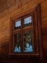 Vintage brown country wooden window. Antique traditional building exterior detail. Travel photo. Retro rustic wood board Royalty Free Stock Photo