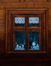 Vintage brown country wooden window. Antique traditional building exterior detail. Travel photo. Retro rustic wood board