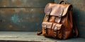 A vintage brown leather backpack rests on a rustic wooden surface. Generative AI Royalty Free Stock Photo