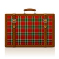 Vintage brown threadbare suitcase with tartan ornament