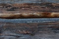 Vintage brown wood background texture with knots and nail holes. Old painted wood wall. Vintage wooden dark horizontal boards. Royalty Free Stock Photo