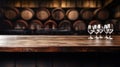 Vintage brown wood table and wine glasses on blurred cellar background, old empty desk in restaurant, bar or cafe. Wooden barrels