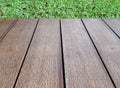 vintage hardwood patio floor with green grass lawn