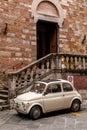 Vintage buggy car parked in a street in Siena, Italy