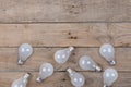 Vintage bulbs on wooden background - idea, innovation, teamwork and leadership concept. Space for text Royalty Free Stock Photo