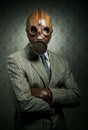 Vintage businessman wearing gas mask