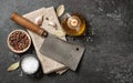 Vintage butcher cleaver and spices for cooking on kitchen table Royalty Free Stock Photo