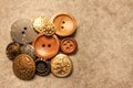 Vintage buttons with lion on old linen