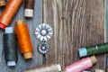 Vintage buttons and oldÃÂ reels of varicolored thread