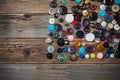 Vintage buttons on the wooden boards