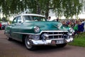 Vintage Cadillac Series 62 green car with a white top and round headlights Royalty Free Stock Photo