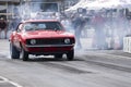 Vintage camaro making a smoke show on the race track at the starting line Royalty Free Stock Photo