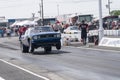 Vintage camaro making a wheelie on the race track at the starting line Royalty Free Stock Photo