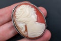 vintage cameo brooch on a woman's hand, old retro jewelry Royalty Free Stock Photo