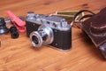 Vintage camera and accesoriess on wooden background Royalty Free Stock Photo