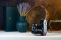 Vintage camera with bellows, accordion on a white table. Royalty Free Stock Photo