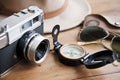 Vintage camera, compass, sunglasses and hat. Royalty Free Stock Photo