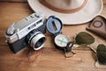 Vintage camera, compass, sunglasses and hat. Royalty Free Stock Photo