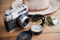 Vintage camera, compass, sunglasses and hat. Royalty Free Stock Photo