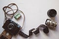 vintage camera, film, retro lenses on white table, copy space