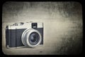 Vintage camera on a grunge background Royalty Free Stock Photo
