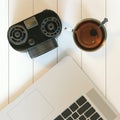 Vintage camera and laptop and glass cup of hot tea on white hard Royalty Free Stock Photo