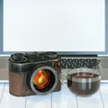 Vintage camera and laptop and glass cup of hot tea Royalty Free Stock Photo