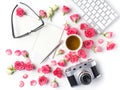 Vintage camera pink roses and note on white background. Flat lay. Top view Royalty Free Stock Photo