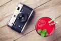 Vintage camera and raspberry smoothie Royalty Free Stock Photo