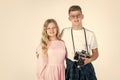 Vintage camera technology. shooting with professional camera. photographing is their hobby. teen children with retro