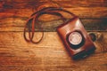 Vintage camera on wooden background