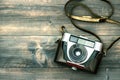 Vintage camera on wooden background. Retro style toned picture Royalty Free Stock Photo