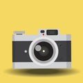 Vintage camera yellow background Royalty Free Stock Photo