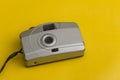 Vintage camera with yellow background Royalty Free Stock Photo