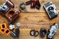 Vintage cameras and lenses on the background of old boards. Place for text Royalty Free Stock Photo