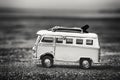 Vintage Camper Toy with Surfing Boards on Beach Royalty Free Stock Photo