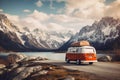 Vintage campervan finds its idyllic resting spot against the backdrop of a breathtaking mountain landscape. Ai generated