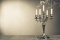 Vintage candelabrum with five reek candles sepia photo