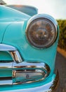 Vintage Car Front Detail. Classic car headlights close-up. Headlights of yellow vintage car. Exhibition