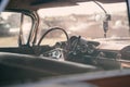 Vintage car interior with steering wheel and dashboard. Retro car background Royalty Free Stock Photo