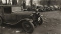 Vintage car in the old town. Black and white photo.