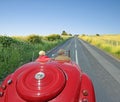 Vintage car open road touring Royalty Free Stock Photo