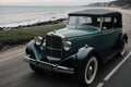 A vintage car parked by the beach