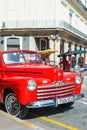 Vintage car parked on a famous street in Havana