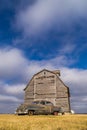 Vintage car and rustic barn. Royalty Free Stock Photo