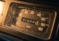 Vintage car speedometer displaying 410.5 kilometers Royalty Free Stock Photo