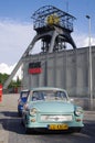 Vintage car Trabant in front of historic lift tower